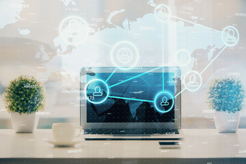 Poster - Computer on desktop with social network hologram. Double exposure. Concept of international people connections.