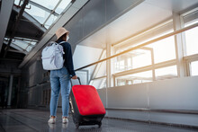 Traveler With Suitcase In Airport Concept.Young Girl Walking With Carrying Luggage And Passenger For Tour Travel Booking Ticket Flight At International Vacation Time In Holiday Rest And Relaxation..
