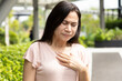 Middle-aged woman having gerd acid reflux, heartburn inflammation