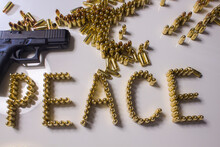Glock Pistol And The Inscription Peace With Cartridges 9mm