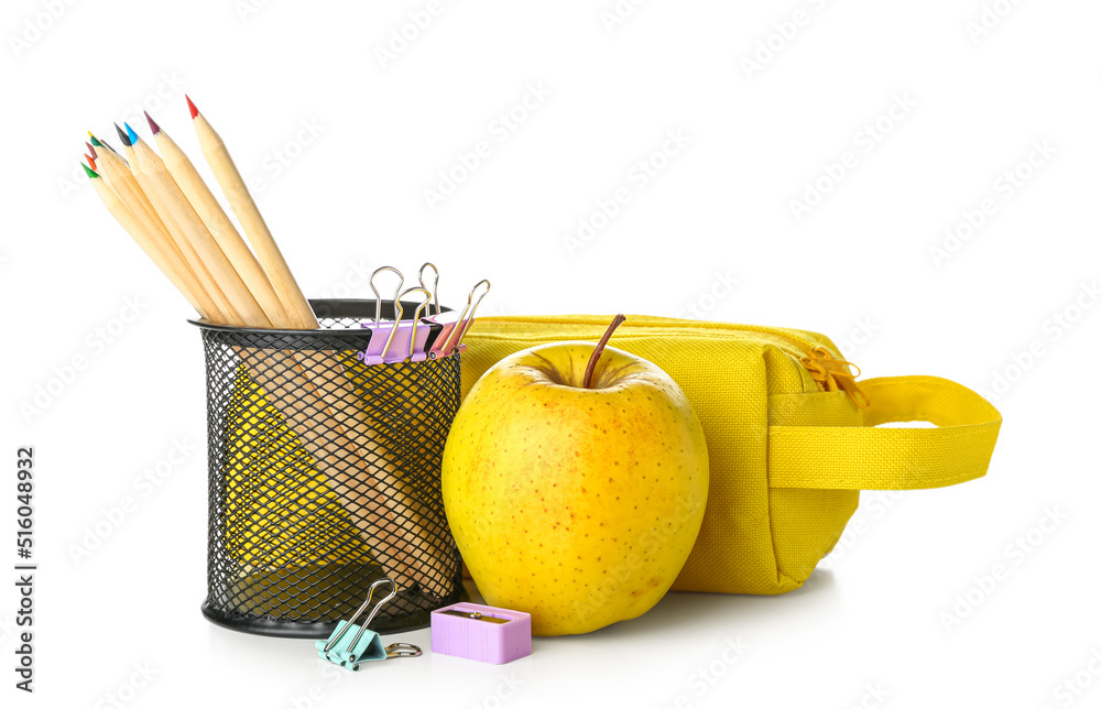 School stationery with pencils case and apple on white background