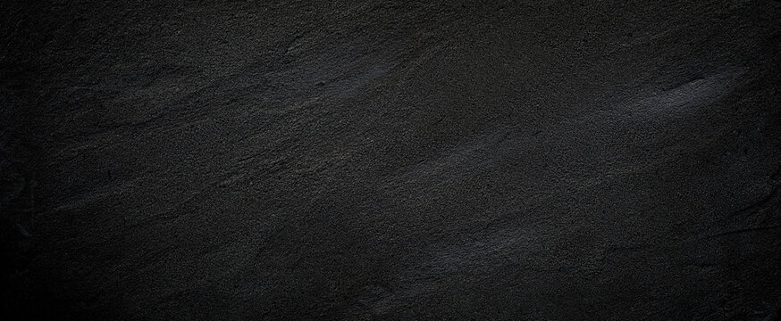 black or dark gray rough grainy stone or sand texture background