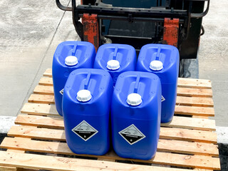 Sticker - Corrosive chemical symbols on a blue chemical tank