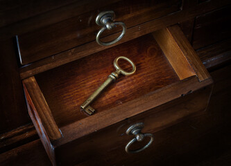 Fototapete - Antique key in a cabinet drawer. Find the right key for the lock. Concept and idea on the theme of security, history, protection, protection, mystery, conservation, etc. Retro style.