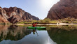 Adventurous Woman on a Kayak paddling in Colorado River. Glen Canyon, Arizona, United States of America. American Mountain Nature Landscape Background. Adventure Travel