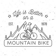 Wall Mural - Life is better on a mountain bike. Vector illustration. Concept for shirt or logo, print, stamp or tee. Vintage line art design with man riding bike and mountain silhouette. Outdoor adventure.