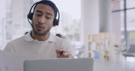 Aufkleber - Confident businessman using a laptop and headset on a conference call in a modern office. Young professional man discussing business plan with investors. Rep or customer service agent calling client