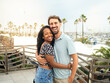 Happy diverse smiling heterosexual young couple looking at camera during vacation. happy couple,honeymoon,vacation