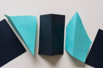 paper shapes with 3d qualities on blank paper