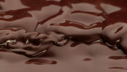 Canvas Print - Melted chocolate in detail, floating on surface.