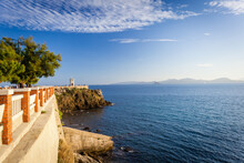 Sunset View Of Piazza Bovio With Lighthouse In Piombino And Elba Island