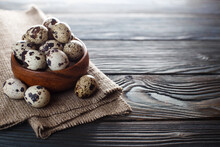 Wooden Bowl With Delicious Quail Eggs On Wooden Background