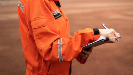 Wall Mural - a management person is holding a luxury pen, preparing to take note on paper during perform safety a