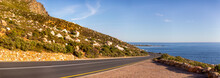 Panoramic Road Of The Garden Route And Clarence Drive With The Atlantic Ocean In The Background This Area Is Known As Gordon Bay's In South Africa Is A Road That Runs Along The Coast Of Fynbos.