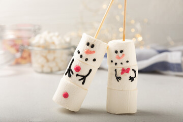 Marshmallow Snowman. A sweet treat for kids is a funny marshmallow snowman. Christmas winter holiday decoration. New Year card. Winter hot drink. Decor for a drink.