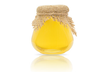 Wall Mural - glass jar with fresh honey on a white background