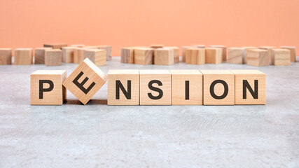 pension word written on wood block. content text on wooden table for your desing, concept.