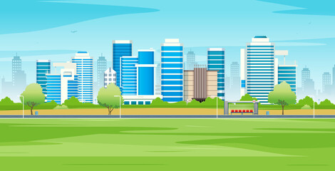 Wall Mural - City buildings with green lawns and streets with sky in the background.