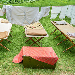 An old military field hospital with retro tents and vintage medical beds from the First World War. Mobile clinic for the treatment of soldiers of the early twentieth century