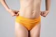 Skinny belly after tummy tuck, plastic surgery concept