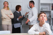 © JackF - Portrait of unhappy boy sitting at home while parents and grandma quarreling
