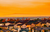 Fototapeta Góry - Suburban Orange County housing at sunset in Southern California	