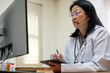 © weedezign - asian woman doctor visit patient video call online diagnose symptom at clinic