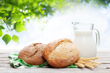 Poster - Homemade bread and milk on wooden table