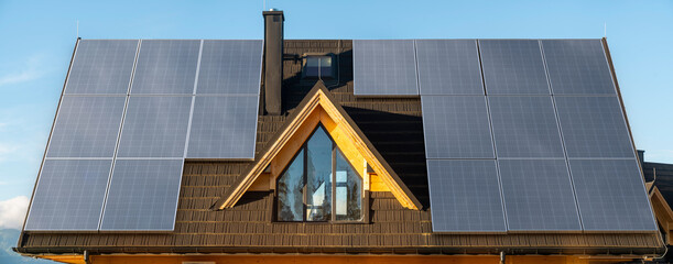 Wall Mural - photovoltaic panels on the roof of the house