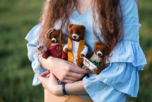 Woman Standing With Handmade Soft Toys