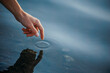 © Westend61 - Hand of man touching sea water