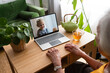 © Westend61 - Senior woman talking on video call with granddaughter through laptop
