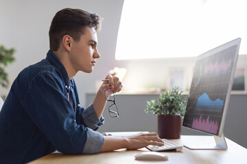 Poster - Financial Analytics. Millennial Male Entrepreneur Working With Computer In Office