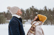 people, love and leisure concept - happy smiling couple catching snow with open mouth in winter