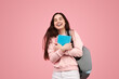 © kegfire - Delighted young student with copybooks smiling after exams