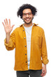 © Syda Productions - people and fashion concept - happy smiling man in glasses and yellow jacket waving hand over white background