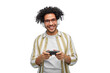 © Syda Productions - technology, people and leisure concept - happy smiling young man in headphones with gamepad playing video game over white background