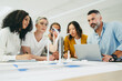 © Jacob Lund - Multicultural designers working on a wind turbine project