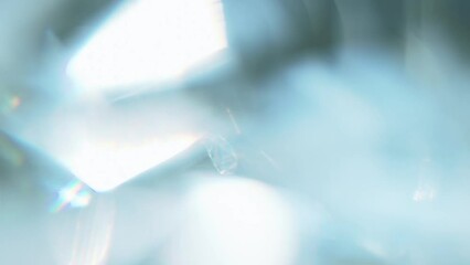 Wall Mural - Sun Glare in the Heavenly Surroundings. Loop. The light passes through the facets of a slowly rotating diamond and creates repetitive sparkling highlights and rainbow colors