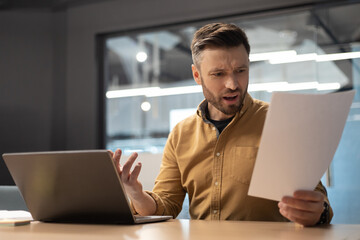 Sticker - Shocked Businessman Holding Papers Having Issue Sitting In Modern Office