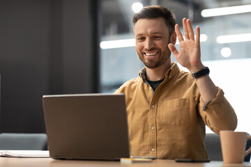 Poster - Entrepreneur Waving Hello To Laptop Making Video Call At Workplace