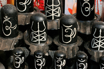 Small lingams sold near a Hindu temple