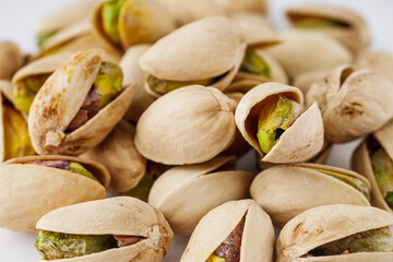 fresh salted pistachios on a white background