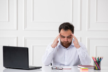 ADHD cute young office worker at work behind the desk with the computer trying to be focused