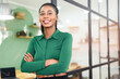 © Vadim Pastuh - Portrait of confident African-American businesswoman standing with arms crossed, multiracial female office employee in smart casual wear looking at the camera and smiles