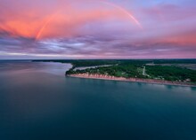 Aerial View Of The Chimney Bluffs In  Ontario Lake At Sunset