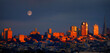 Sunset Light Shining on San Francisco Buildings Skyscrapers Skyline With Full Moon Rising