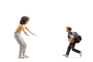 Poster - Full length profile shot of a schoolboy running towards a young woman