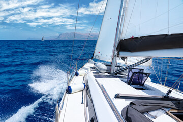 Summer yacht cruise on the Mediterranean Sea around the coast of Sicily on a hot summer day