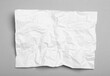 © New Africa - Sheet of white crumpled paper on grey background, top view
